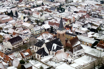 Church in winter with snow in the district Schaidt in Wörth am Rhein in the state Rhineland-Palatinate, Germany