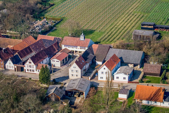 Main street with church in the community center and fire department in Vollmersweiler in the state Rhineland-Palatinate, Germany