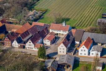 Aerial view of Main street with church in the community center and fire department in Vollmersweiler in the state Rhineland-Palatinate, Germany
