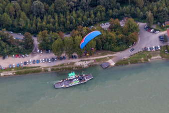 Ride a ferry ship across the Rhine in the district Neuburgweier in Au am Rhein in the state Baden-Wurttemberg, Germany