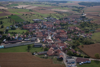 Village - view on the edge of agricultural fields and farmland in Ingenheim in Grand Est, France
