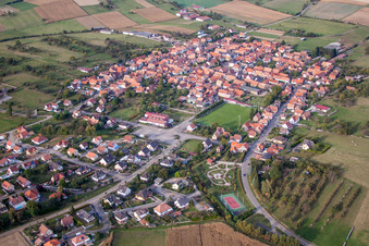 Aerial photograpy of Village - view on the edge of agricultural fields and farmland in Uhrwiller in Grand Est, France