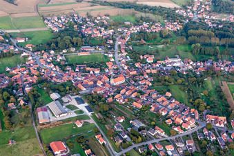 Village - view on the edge of agricultural fields and farmland in Riedseltz in Grand Est, France from above