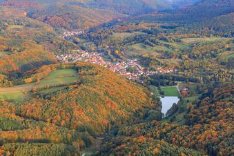 Village view in the Palatinate Forest behind Lake Silz from the west in Silz in the state Rhineland-Palatinate, Germany