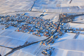 Village view from the south in winter with snow in the district Wollmesheim in Landau in der Pfalz in the state Rhineland-Palatinate, Germany