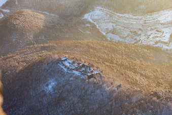 Drone recording of Madenburg castle ruins in winter with snow in Eschbach in the state Rhineland-Palatinate, Germany