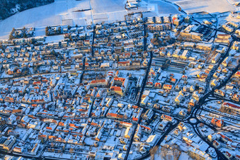 Königstraße with castle Bad Bergzabern in winter with snow in Bad Bergzabern in the state Rhineland-Palatinate, Germany