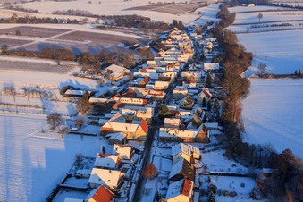 Aerial view of Village view from the west in winter with snow in Vollmersweiler in the state Rhineland-Palatinate, Germany
