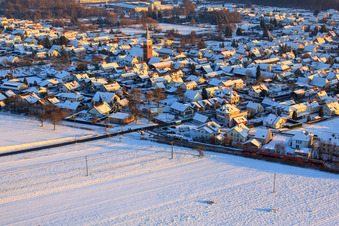 Volmersweilerer Straße in winter with snow in the district Schaidt in Wörth am Rhein in the state Rhineland-Palatinate, Germany