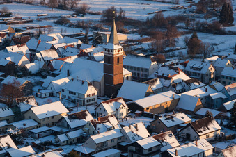 Wintry snowy Church building in the village of in the district Schaidt in Woerth am Rhein in the state Rhineland-Palatinate, Germany