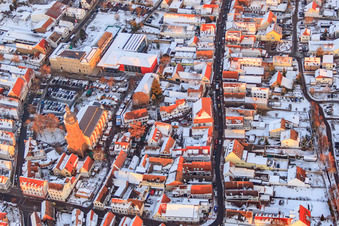 Oblique view of Primary school, town hall and St. George's Church on the market square in winter with snow in Kandel in the state Rhineland-Palatinate, Germany