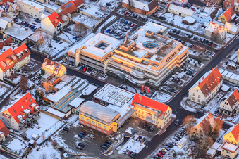 Municipal administration and savings bank on Gartenstraße in winter with snow in Kandel in the state Rhineland-Palatinate, Germany