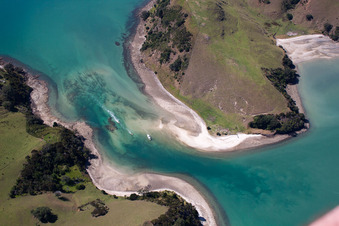 Water surface at the seaside between twi islands in the Mcgregor Bay in Wyuna Bay in Waikato, New Zealand