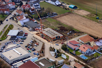 Oblique view of Karlshöhlchen commercial area with Heinz Memmer car dealership in Freckenfeld in the state Rhineland-Palatinate, Germany