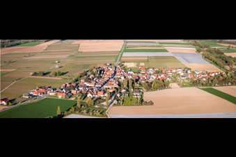 Panoramic perspective Village - view on the edge of agricultural fields and farmland in Kleinfischlingen in the state Rhineland-Palatinate, Germany