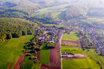 Village - view on the edge of agricultural fields and farmland in Langensoultzbach in Grand Est, France