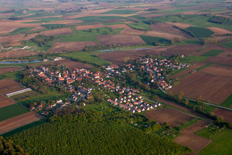 Aerial view of Village - view on the edge of agricultural fields and farmland in Kutzenhausen in Grand Est, France