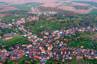 Village - view on the edge of agricultural fields and farmland in Riedseltz in Grand Est, France out of the air