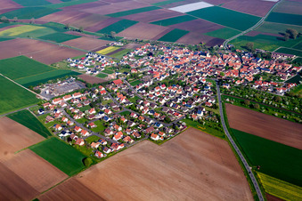 Aerial view of Village - view on the edge of agricultural fields and farmland in Oberpleichfeld in the state Bavaria, Germany