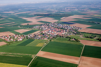 Village - view on the edge of agricultural fields and farmland in Theilheim in the state Bavaria, Germany