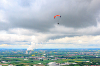 Paraglider in front of Grafenrheinfeld nuclear power plant in Röthlein in the state Bavaria, Germany