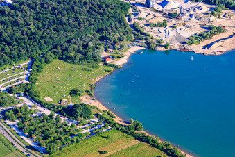 Sunbathing lawn at Epplesee covered with bathers in the district Silberstreifen in Rheinstetten in the state Baden-Wuerttemberg, Germany