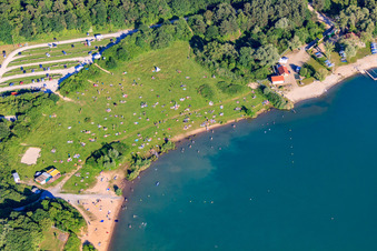 Oblique view of Sunbathing lawn at Epplesee covered with bathers in the district Silberstreifen in Rheinstetten in the state Baden-Wuerttemberg, Germany