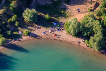 Oblique view of Nudist beach Epplesee crowded with bathers in the district Forchheim in Rheinstetten in the state Baden-Wuerttemberg, Germany