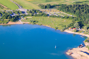 Sunbathing lawn at Epplesee full of bathers in the district Silberstreifen in Rheinstetten in the state Baden-Wuerttemberg, Germany