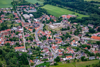 Village - view on the edge of agricultural fields and farmland in Hausneindorf in the state Saxony-Anhalt, Germany