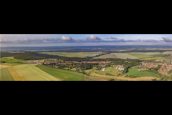 Panoramic perspective Village - view on the edge of agricultural fields and farmland in Langenstein in the state Saxony-Anhalt, Germany