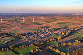 Village view in front of wind farm from southwest in Herxheimweyher in the state Rhineland-Palatinate, Germany