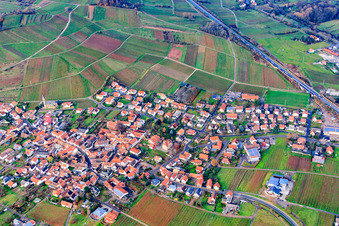 Wine-growing village between bare vineyards from the southeast in Birkweiler in the state Rhineland-Palatinate, Germany