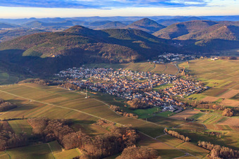Aerial view of Wine village in winter between bare vineyards from the southeast in Klingenmünster in the state Rhineland-Palatinate, Germany