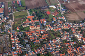 Oblique view of St. Paulus Stift Herxheim and Caritas Support Center St. Laurentius and Paulus in Herxheim bei Landau in the state Rhineland-Palatinate, Germany