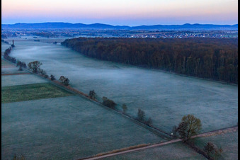 Oblique view of Otterbach lowlands in the morning mist in Freckenfeld in the state Rhineland-Palatinate, Germany
