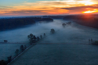 Aerial view of Otterbach lowlands in the morning mist at sunrise in Minfeld in the state Rhineland-Palatinate, Germany