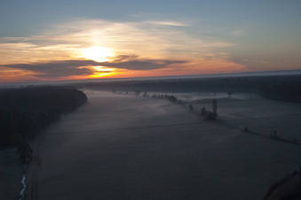 Aerial photograpy of Sunrise haze at structures of a field landscape Otterbachtal in Minfeld in the state Rhineland-Palatinate