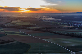 Aerial view of Railway line to Weissenburg at sunrise in Freckenfeld in the state Rhineland-Palatinate, Germany