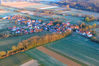 Village view in the morning mist from the southeast in Hergersweiler in the state Rhineland-Palatinate, Germany