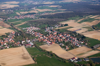 Aerial photograpy of Village - view on the edge of agricultural fields and farmland in Kutzenhausen in Grand Est, France