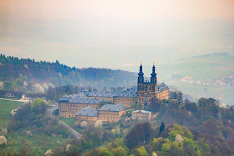 Aerial view of Banz Monastery with the monastery church of St. Dionysius and St. Peter on a mountain above the Main in the district Unnersdorf in Bad Staffelstein in the state Bavaria, Germany
