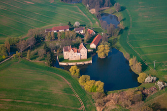 Oblique view of Buildings and castle park - facilities of the moated castle Brennhausen in the district Brennhausen in Sulzdorf an der Lederhecke in the state Bavaria, Germany