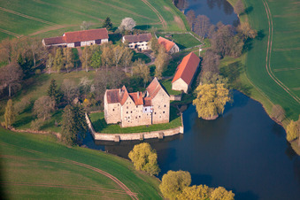 Buildings and castle park - facilities of the moated castle Brennhausen in the district Brennhausen in Sulzdorf an der Lederhecke in the state Bavaria, Germany from above