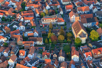 Church Hagenbach and Sparkasse Südpfalz in Ludwigstr in Hagenbach in the state Rhineland-Palatinate, Germany