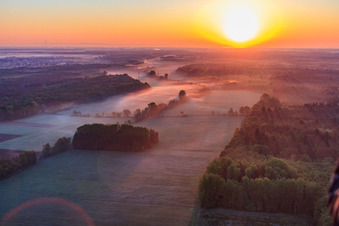 Aerial view of Sunrise over the Otterbach lowlands in the morning mist in Minfeld in the state Rhineland-Palatinate, Germany