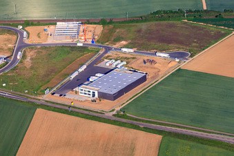 Aerial view of TRANSAC International Shipping Company Ltd. and construction site of Resinnovation GmbH in Rülzheim in the state Rhineland-Palatinate, Germany