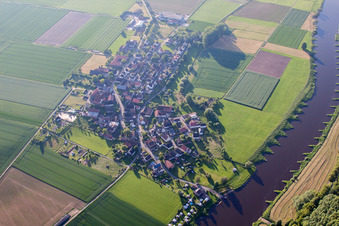 Aerial view of Village on the river bank areas of the Weser river in Brevoerde in the state Lower Saxony, Germany