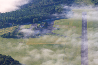 Aerial view of Runway of the Höxter-Holzminden (EDVI) airfield in the early morning fog in the district Albaxen in Höxter in the state North Rhine-Westphalia, Germany