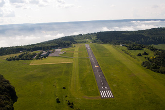 Aerial photograpy of Runway with tarmac terrain of airfield Hoexter-Holzminden with morning mist in the district Brenkhausen in Hoexter in the state North Rhine-Westphalia, Germany